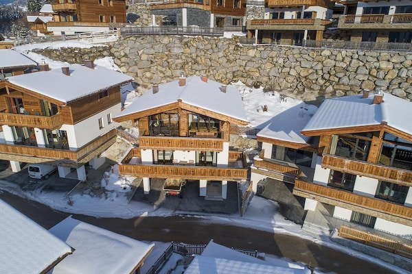 Foto van Alpenchalet met sauna en balkon - Vakantiehuis in Neukirchen - ExteriorWinter
