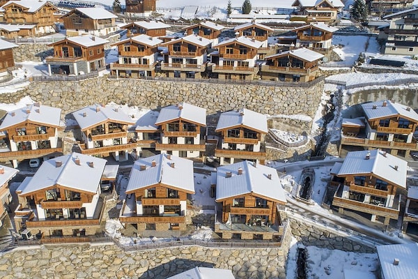 Foto van Alpenchalet met sauna en balkon - Vakantiehuis in Neukirchen - ExteriorWinter
