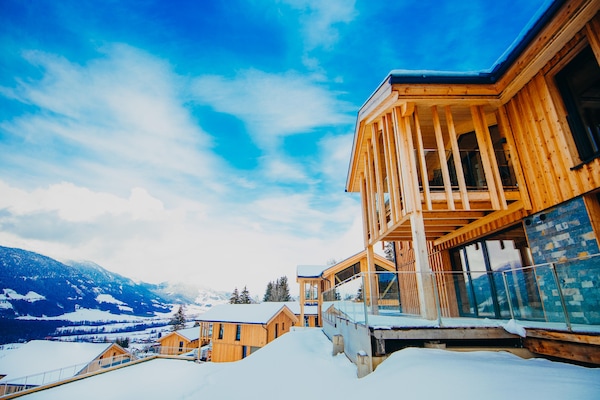 Foto van Luxe chalet met zwembad en sauna bij de skilift - Vakantiehuis in Ennsling - ExteriorWinter