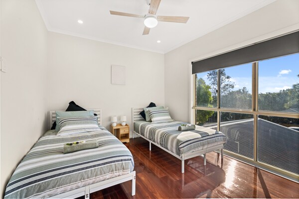 Foto van Familiehuis met 4 slaapkamers aan de kust van Hervey Bay, vlakbij het strand. - BedRoom
