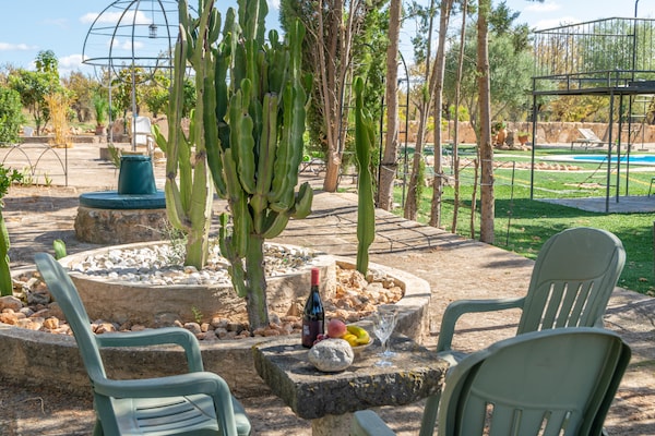 Foto van Villa in Santa Maria met zoutwaterzwembad - Vakantiehuis in Santa María Del Cami, Illes Balears - GardenSummer