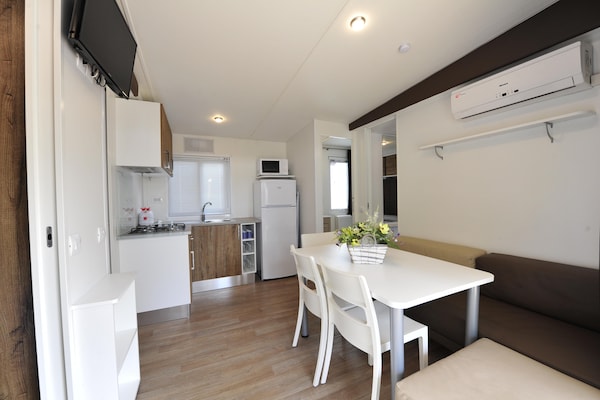 Foto van Stacaravan op vakantiepark Bella italia - Vakantiehuis in Peschiera - LivingRoom
