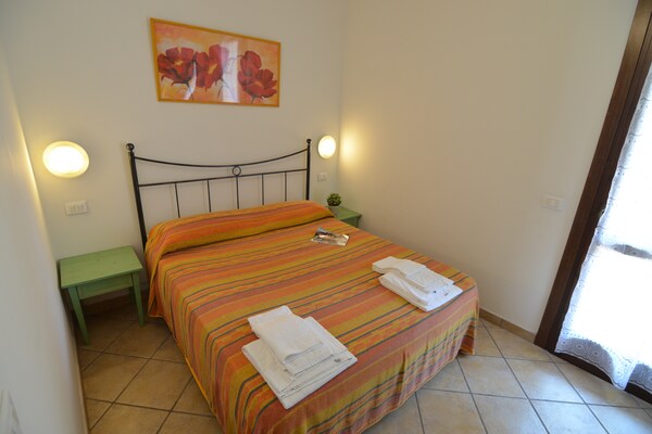 Foto van Resortappartement met zwembad - Vakantiehuis in Lido di Spina - BedRoom