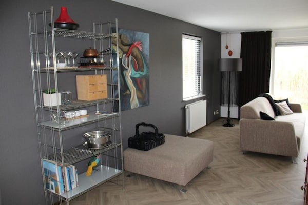 Foto van Bungalow in Breskens bij Strand en Vuurtoren - Vakantiehuis in Breskens - LivingRoom