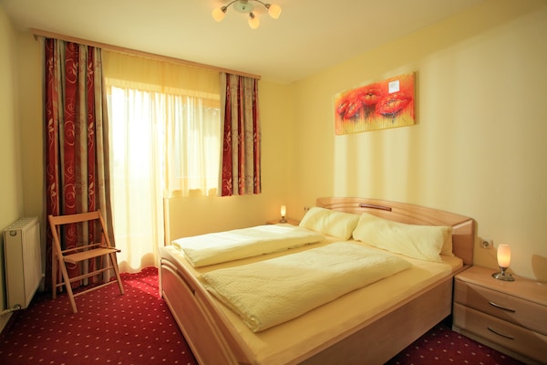 Foto van Appartement avec étang de baignade - Vakantiehuis in Brixen im Thale - BedRoom