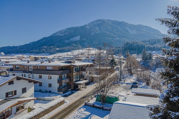 Foto van Appartement avec étang de baignade - Vakantiehuis in Brixen im Thale - ExteriorWinter