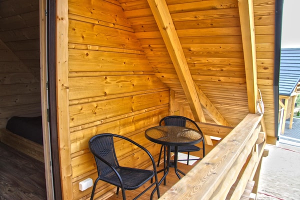 Foto van Comfortabele vakantiehuizen met open haard - Vakantiehuis in Lubrza - TerraceBalcony