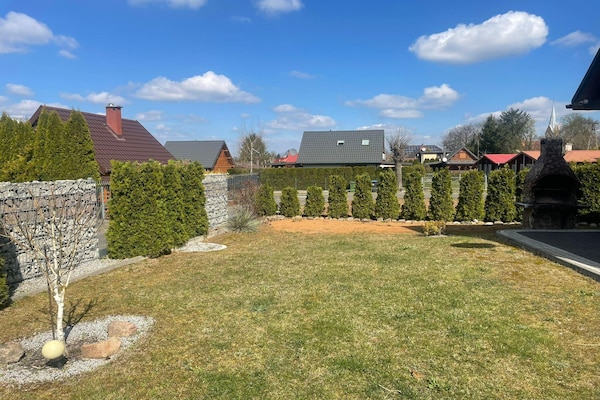 Foto van Comfortabele vakantiehuizen met open haard - Vakantiehuis in Lubrza - GardenSummer
