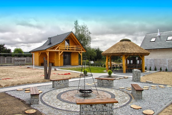 Foto van Comfortabele vakantiehuizen met open haard - Vakantiehuis in Lubrza - ExteriorSummer