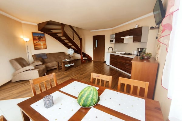 Foto van Comfortabele vakantiehuizen, bad, jacuzzi, sauna - Vakantiehuis in Osieki - LivingRoom