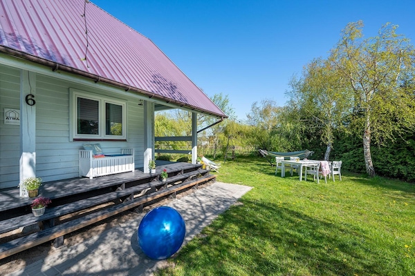 Foto van Comfortabel vakantiehuis met open haard en terras - Vakantiehuis in Bobolin - ExteriorSummer