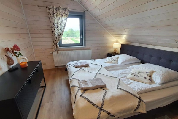 Foto van Comfortabel vakantiehuis met terras en tuin. - Vakantiehuis in Wdzydze Tucholskie - BedRoom