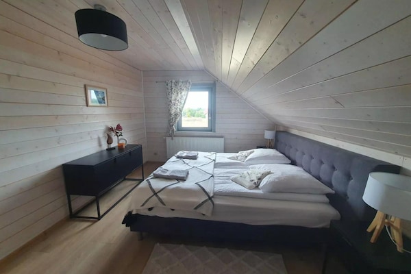 Foto van Comfortabel vakantiehuis met terras en tuin. - Vakantiehuis in Wdzydze Tucholskie - BedRoom