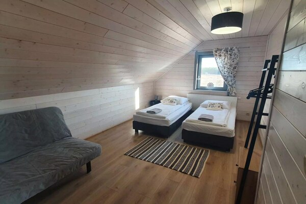Foto van Comfortabel vakantiehuis met terras en tuin. - Vakantiehuis in Wdzydze Tucholskie - BedRoom