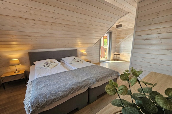 Foto van Comfortabel vakantiehuis met terras en tuin. - Vakantiehuis in Wdzydze Tucholskie - BedRoom